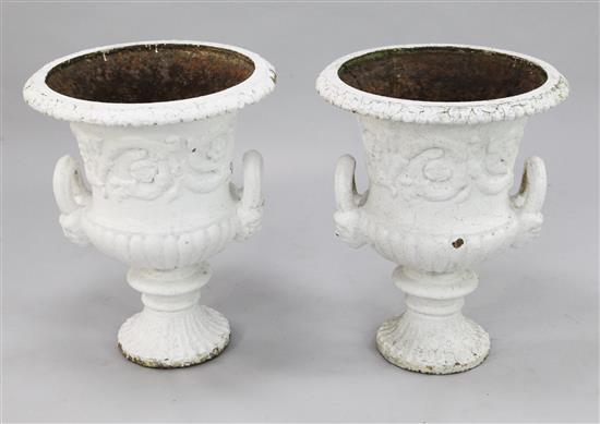 A pair of Victorian white painted campana shaped urns, 1ft 6in. x 1ft 11in.